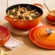 Kit Panela Marmita 26 cm e Suporte de Silicone Laranja Le Creuset